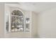 Bright bedroom with large windows, neutral walls, and tile flooring, offering a serene space at 2933 Birmingham Blvd, Orlando, FL 32829