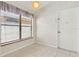 Bright dining area with a window and access to the front door at 2933 Birmingham Blvd, Orlando, FL 32829