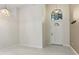Bright foyer featuring tile floors, a transom window, and high ceilings at 2933 Birmingham Blvd, Orlando, FL 32829