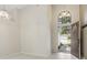 Bright foyer featuring tile floors, a transom window, and high ceilings at 2933 Birmingham Blvd, Orlando, FL 32829