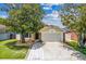 Charming one story home with a two car garage and beautiful mature trees at 2933 Birmingham Blvd, Orlando, FL 32829