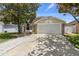 Charming one story home with a two car garage and beautiful mature trees at 2933 Birmingham Blvd, Orlando, FL 32829