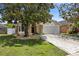 Charming one story home with a two car garage and beautiful mature trees at 2933 Birmingham Blvd, Orlando, FL 32829