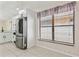 Bright eat-in kitchen with stainless steel refrigerator and view from large window at 2933 Birmingham Blvd, Orlando, FL 32829