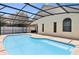 Inviting screened-in pool with ample deck space, perfect for entertaining guests at 2933 Birmingham Blvd, Orlando, FL 32829