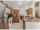 Bright kitchen with stainless steel appliances, granite countertops, and wood cabinetry at 3018 Bransbury Ct, Kissimmee, FL 34747