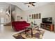 Bright living room with staircase, sofa, and entertainment center at 3018 Bransbury Ct, Kissimmee, FL 34747