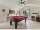 Well-lit living space with billiards table, and neutral color palette at 3018 Bransbury Ct, Kissimmee, FL 34747
