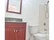 Traditional bathroom with a wood vanity, granite countertop, and white ceramic tiled shower at 3057 Aaron Burr Ave # 2, Winter Park, FL 32792