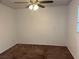Bedroom with ceiling fan, neutral walls, brown carpet flooring, and lots of natural light at 3057 Aaron Burr Ave # 2, Winter Park, FL 32792