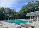 A sparkling community pool offers a refreshing escape, surrounded by lush greenery and comfortable seating at 3057 Aaron Burr Ave # 2, Winter Park, FL 32792