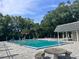 A sparkling community pool offers a refreshing escape, surrounded by lush greenery and comfortable seating at 3057 Aaron Burr Ave # 2, Winter Park, FL 32792
