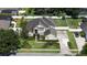 Stunning aerial view of a home showcasing lush landscaping, a water fountain, and manicured lawns at 325 Green Ash Ln, Sanford, FL 32771
