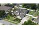 Beautiful home with manicured landscaping, a spacious yard, and a screened-in patio at 325 Green Ash Ln, Sanford, FL 32771