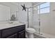 Bathroom with a vanity, toilet, and a glass-enclosed shower at 325 Green Ash Ln, Sanford, FL 32771