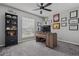Bright bedroom with a ceiling fan, plush carpet, and a large window at 325 Green Ash Ln, Sanford, FL 32771