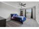 Bedroom with plush carpet featuring a bed, a bookshelf, and a window view at 325 Green Ash Ln, Sanford, FL 32771