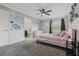 Bedroom with plush carpet featuring a princess decal, door to the bathroom, and a window view at 325 Green Ash Ln, Sanford, FL 32771