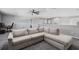 Open concept bonus room featuring plush carpet and a large comfortable sectional at 325 Green Ash Ln, Sanford, FL 32771