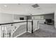 Large bonus room with plush carpet, ceiling fan, and desk area by the window at 325 Green Ash Ln, Sanford, FL 32771