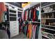Walk-in closet with custom shelving, ample storage for clothes, shoes, and accessories at 325 Green Ash Ln, Sanford, FL 32771