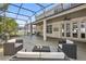 Spacious screened-in patio with elegant wicker furniture for comfortable outdoor living at 325 Green Ash Ln, Sanford, FL 32771
