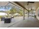Expansive screened-in patio, perfect for entertaining, includes stylish furniture and a grill at 325 Green Ash Ln, Sanford, FL 32771