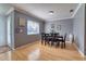Charming dining area with gray walls, wood floors, and natural lighting at 3822 Janie Ct, Orlando, FL 32822
