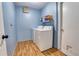 Functional laundry room with side-by-side washer and dryer and storage shelf, ready for everyday convenience at 3822 Janie Ct, Orlando, FL 32822