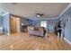 Inviting living room with wood floors, ceiling fan, and comfortable seating arrangement at 3822 Janie Ct, Orlando, FL 32822