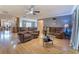 Spacious living room with wood floors and seamless transition to kitchen and dining spaces at 3822 Janie Ct, Orlando, FL 32822