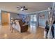 Comfortable living room with wood floors, ceiling fan, and access to the outdoor patio at 3822 Janie Ct, Orlando, FL 32822