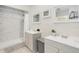 Modern bathroom features marble tile in the shower and updated double sink vanity at 400 Palm Ave, Ormond Beach, FL 32174