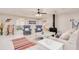 Comfortable living room with bright decor, ceiling fan, fireplace and seating area at 400 Palm Ave, Ormond Beach, FL 32174