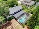 Aerial view of a backyard featuring a screened-in pool and patio area at 4030 Cool Water Ct, Winter Park, FL 32792