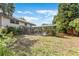 Backyard with a screened-in porch and inground pool, surrounded by mature trees at 4030 Cool Water Ct, Winter Park, FL 32792