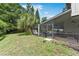 Relaxing screened-in porch and fenced backyard with mature landscaping at 4030 Cool Water Ct, Winter Park, FL 32792