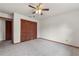 Bedroom featuring a ceiling fan, carpet and a closet with sliding doors at 4030 Cool Water Ct, Winter Park, FL 32792