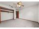 Cozy bedroom featuring plush carpet, ceiling fan and closet space at 4030 Cool Water Ct, Winter Park, FL 32792
