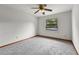 Bedroom featuring a carpeted floor, ceiling fan and a window with natural light at 4030 Cool Water Ct, Winter Park, FL 32792