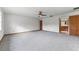 Spacious bedroom with soft carpet, ceiling fan, and access to an ensuite bathroom at 4030 Cool Water Ct, Winter Park, FL 32792