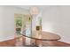 Bright dining room featuring hardwood floors, modern lighting, and sliding door to the outside at 4030 Cool Water Ct, Winter Park, FL 32792