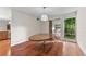 Bright dining room featuring hardwood floors, modern lighting, and views into adjacent living spaces at 4030 Cool Water Ct, Winter Park, FL 32792