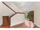 Spacious foyer featuring a staircase and hardwood floors leading to a decorative front door at 4030 Cool Water Ct, Winter Park, FL 32792