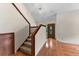 Spacious foyer featuring a staircase and hardwood floors leading to a decorative front door at 4030 Cool Water Ct, Winter Park, FL 32792