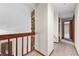 Hallway featuring carpet, wooden doors, stone accent wall and view of front door at 4030 Cool Water Ct, Winter Park, FL 32792