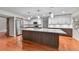 Bright kitchen boasts a large island, stainless steel appliances, and modern cabinets at 4030 Cool Water Ct, Winter Park, FL 32792