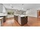 Open kitchen with island and backyard access at 4030 Cool Water Ct, Winter Park, FL 32792