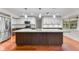 Modern kitchen featuring stainless steel appliances, large island, and sleek finishes at 4030 Cool Water Ct, Winter Park, FL 32792