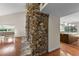 Living room features a stone fireplace and flows into the modern kitchen at 4030 Cool Water Ct, Winter Park, FL 32792